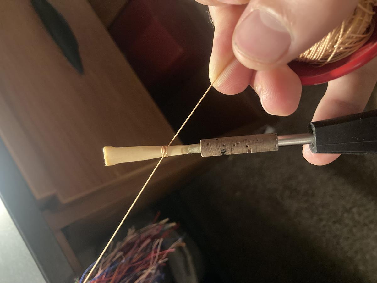Reed being tied to staple